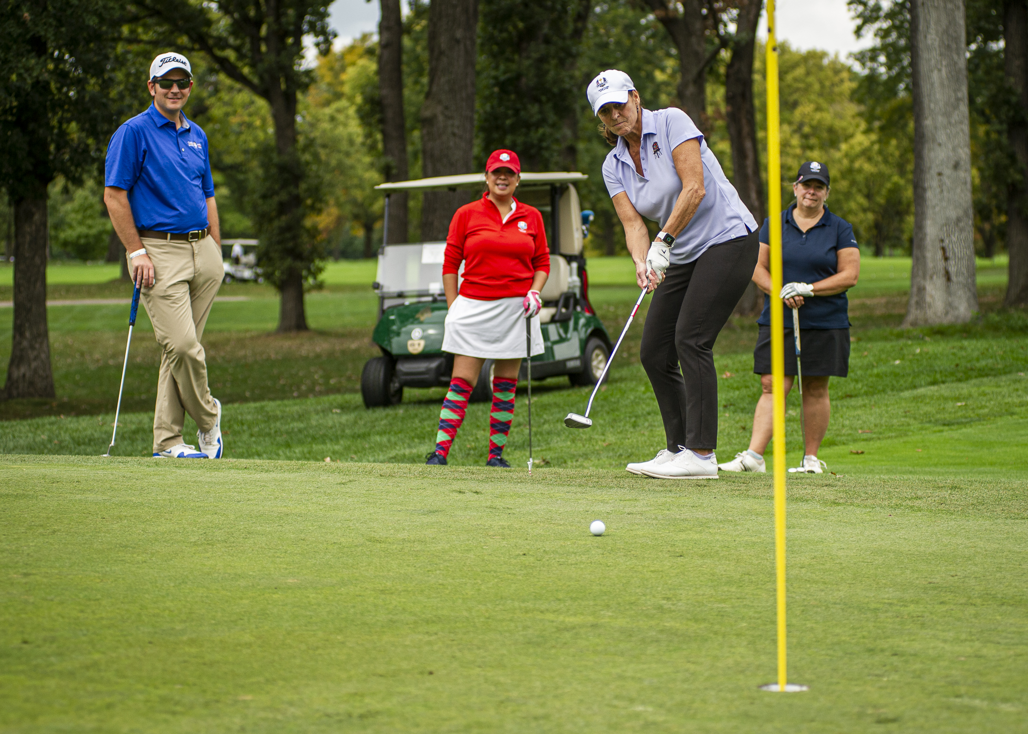 Golfer Putting on Green